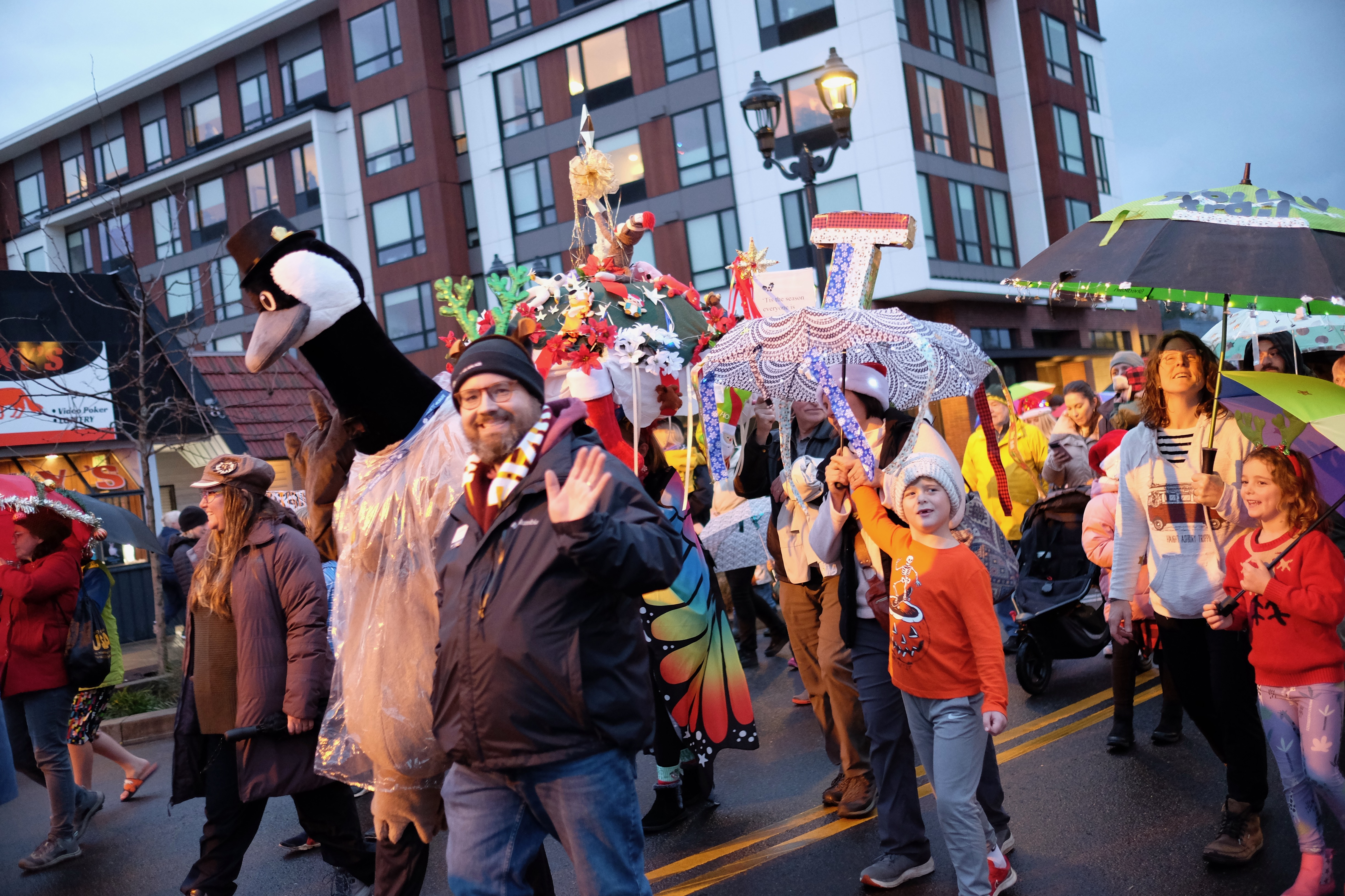 People walking in the 2023 Umbrella Parade