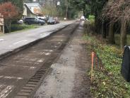 22nd Ave after asphalt grinding in preparation for new sidewalk.  Picture of roadway adjacent to Milwaukie Grange, looking south