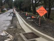 New curb and gutter along 22nd Ave and new catch basin, view from Bluebird St looking south on 22nd Ave.