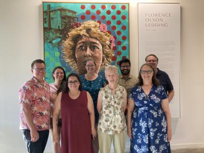 library board members standing in front of painting of florence ledding