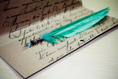 paper and feathered pen